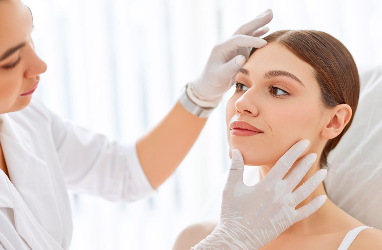 Dermatologist performing a detailed skin analysis before dark spot treatment at Skinfollix Delhi