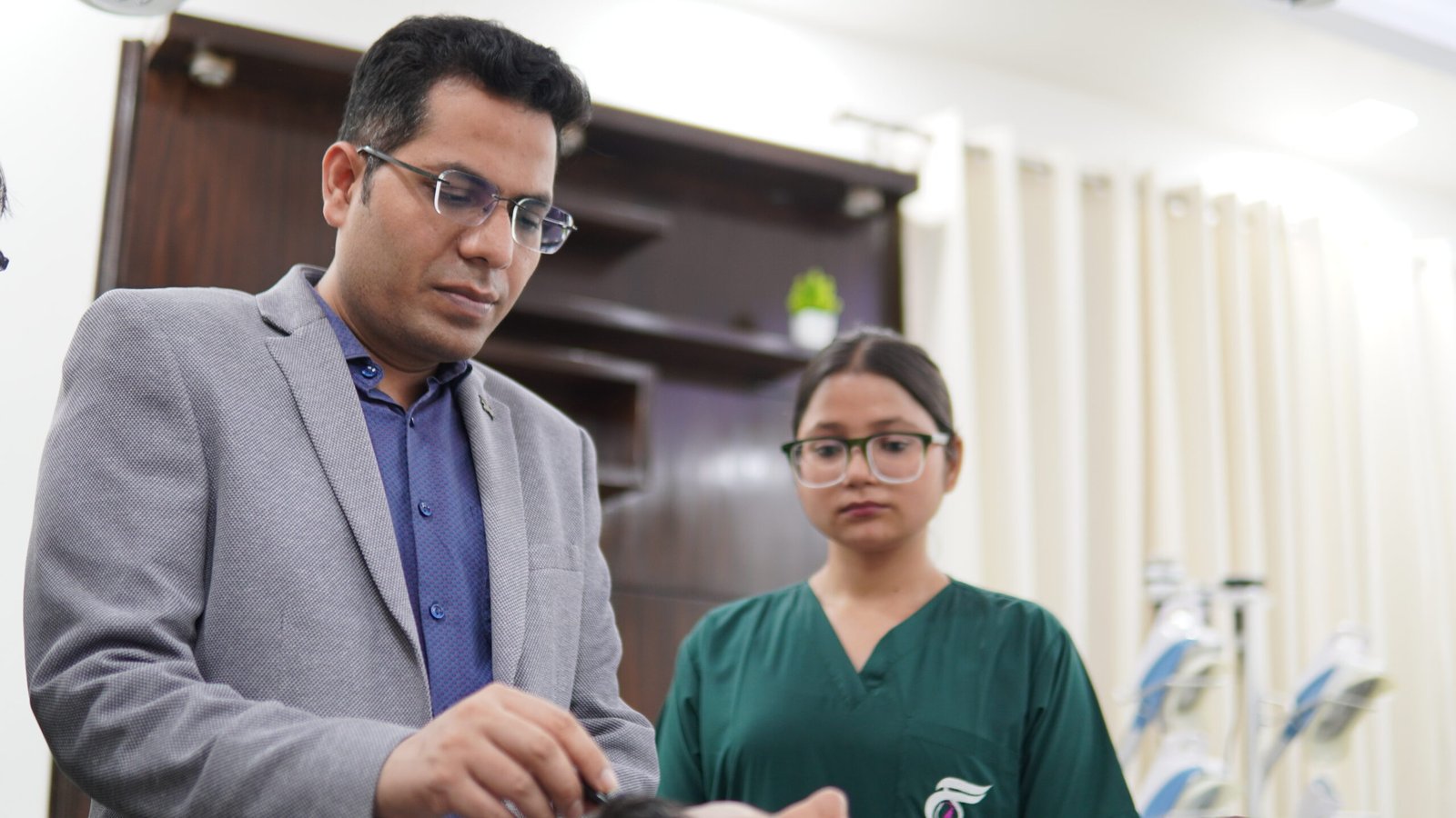 Dr. Vijay Soyal with the hair transplant team at Skinfollix, Delhi