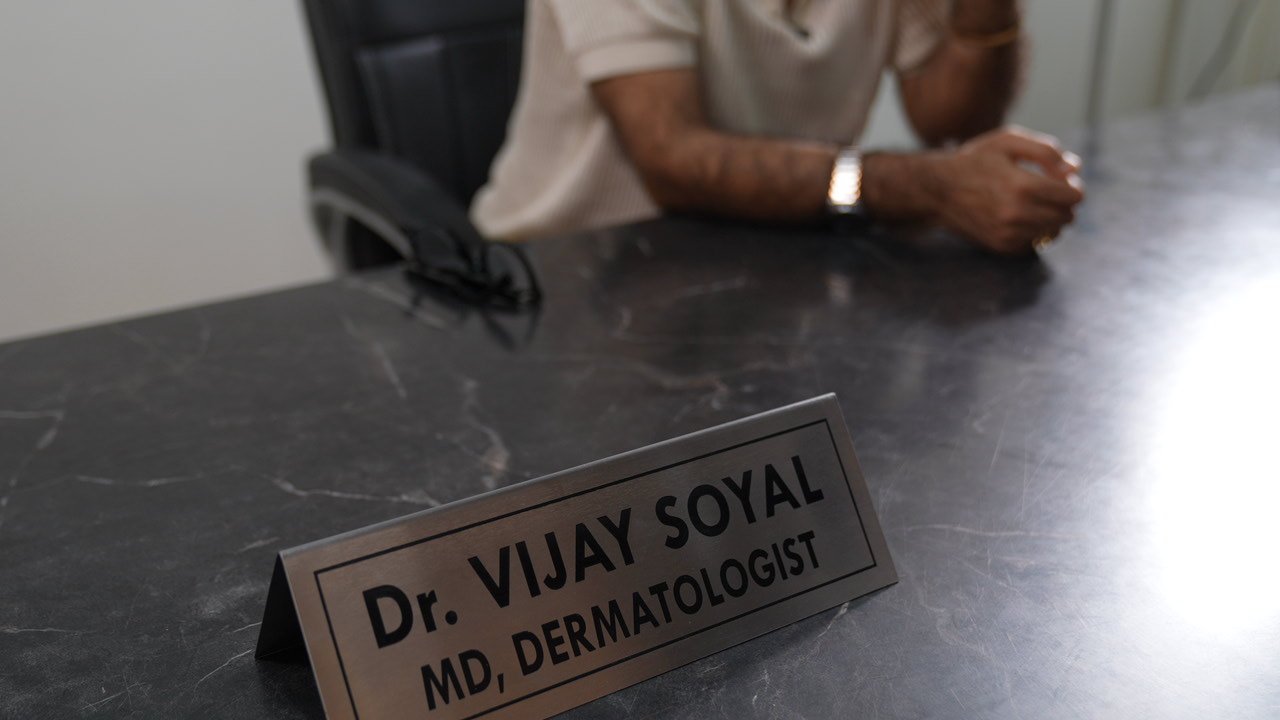 Dermatologist assessing a patient for hair growth treatment in Delhi