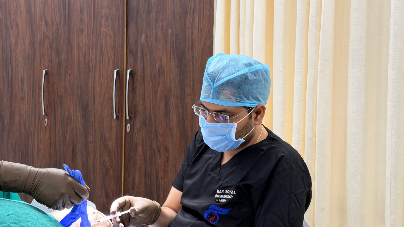 Graft extraction during a hair transplant session at Skinfollix, Delhi